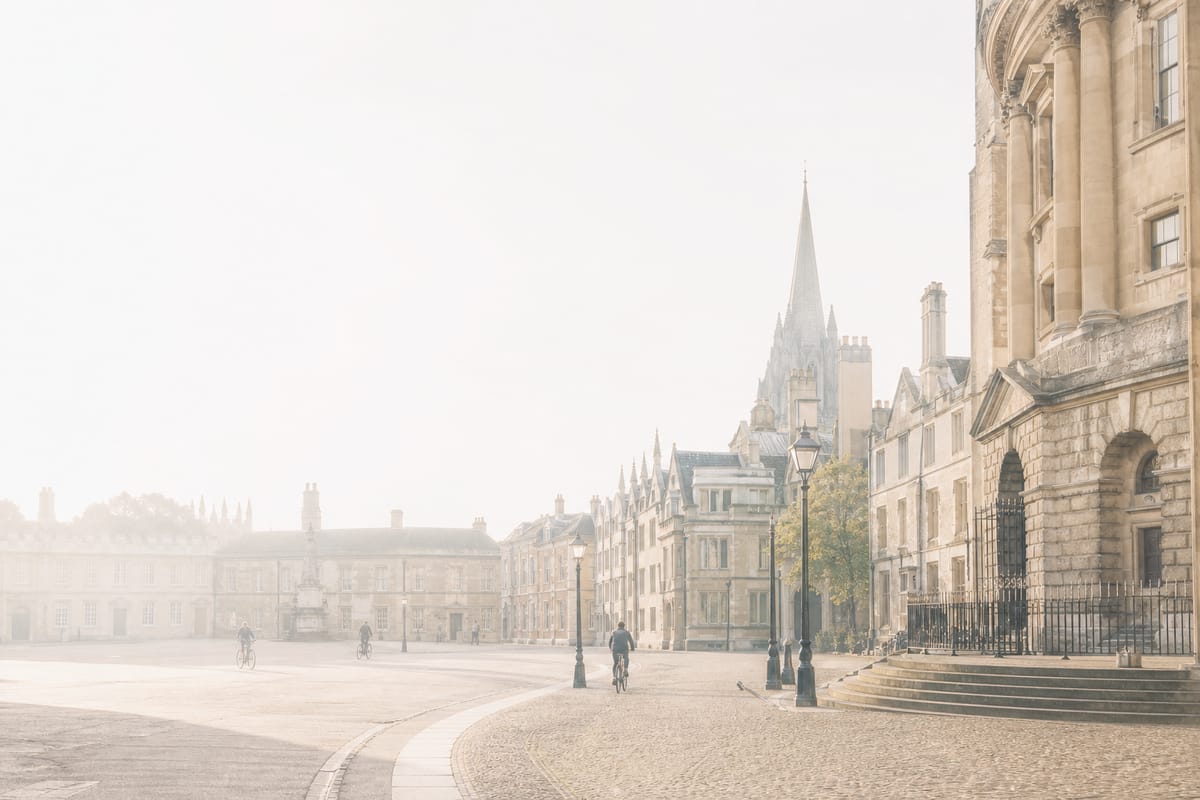 A quiet British town square at dawn